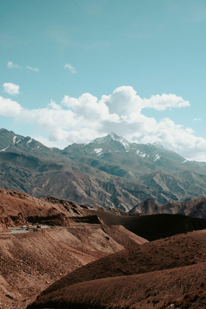 Breathtaking view of the rugged mountain landscape in Leh, India under a bright blue sky.