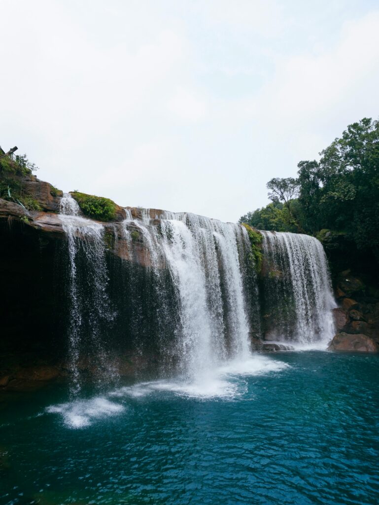 Beautiful waterfall cascading in a forest near Shillong, India.